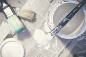 white paint and paintbrushes