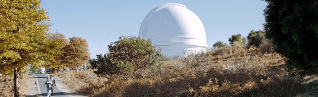 people walk by mount palomar observatory