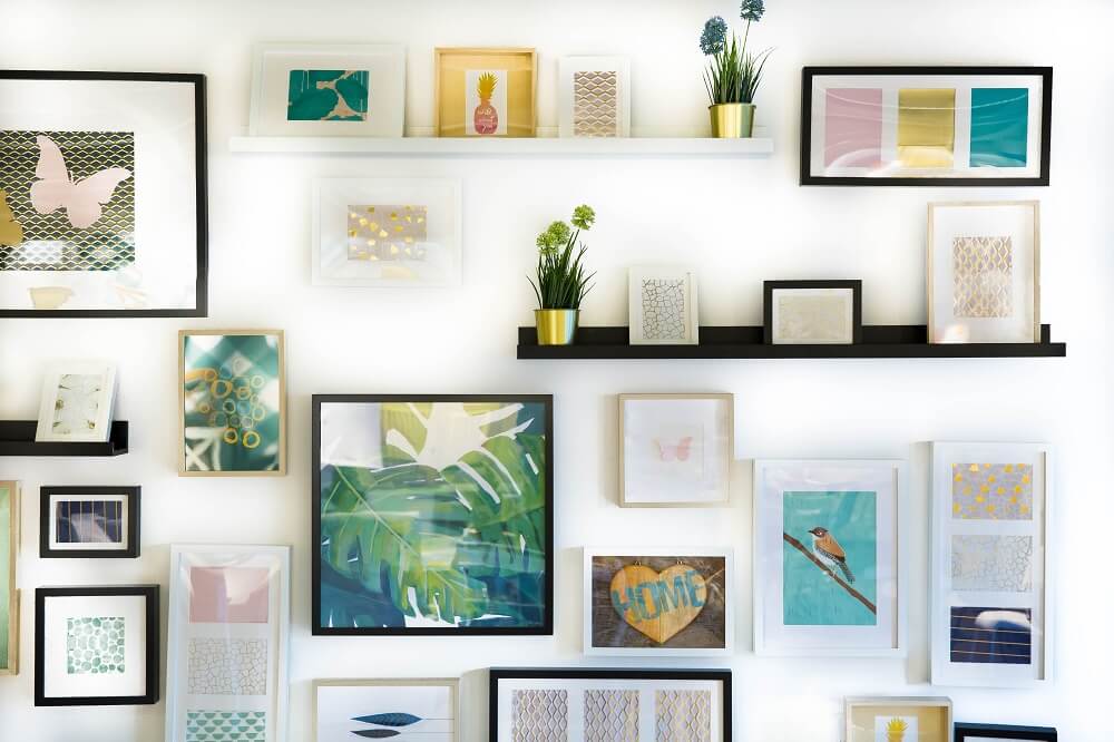 gallery wall of hanging art