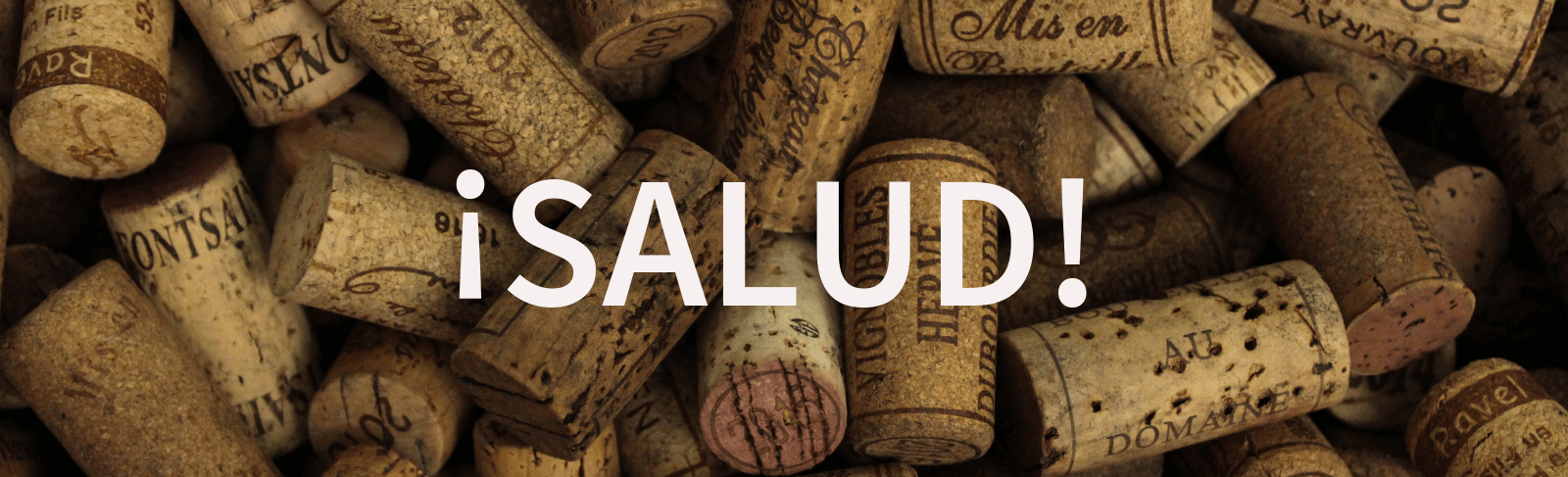 salud on background of wine corks