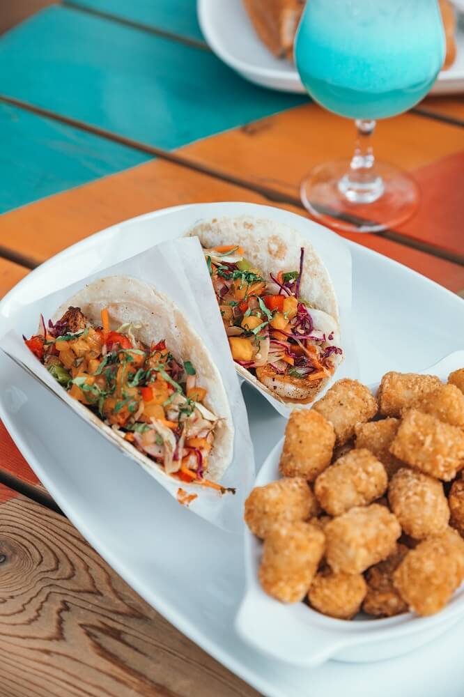 two fish tacos with tater tots