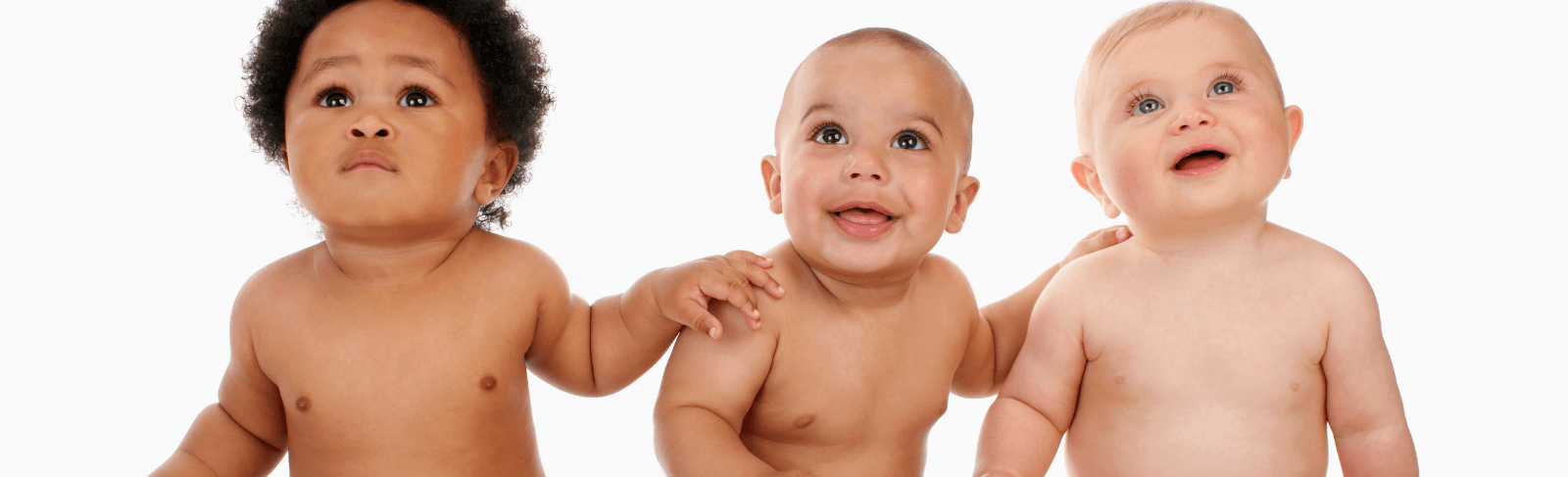 three shirtless babies on white background